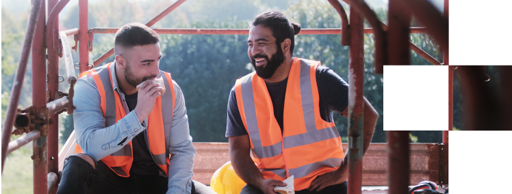 Two tradesman enjoying their lunchbreak