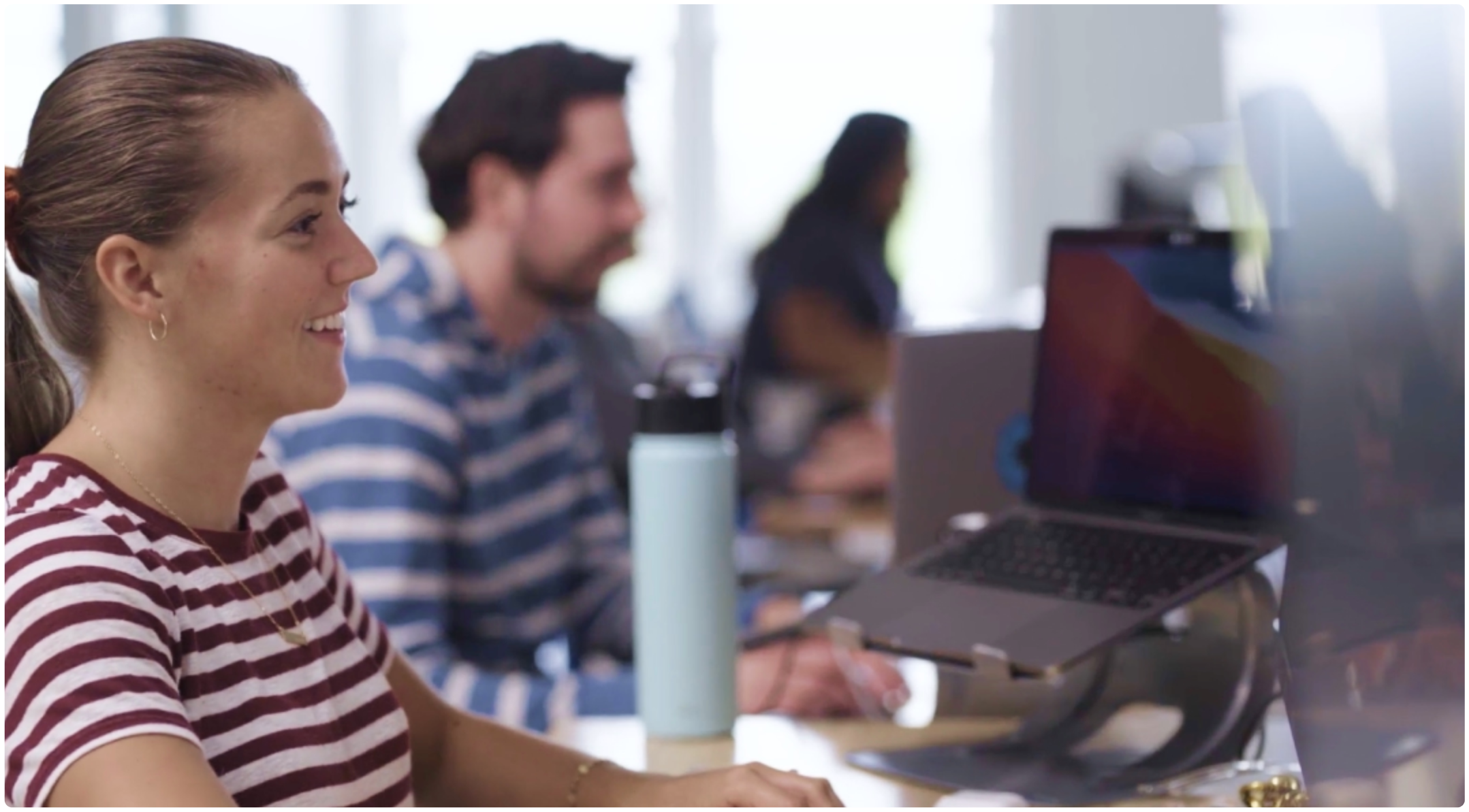 Brokers looking at cyber insurance quotes on the computer 